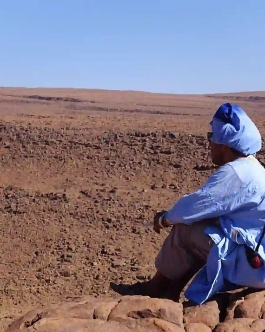 Mohamed Kimou overlooking a vast desert landscape in Southern Morocco